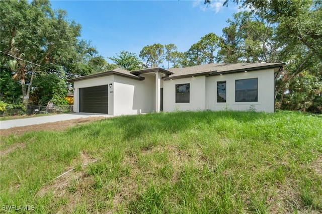 5015 Placid Ln, Labelle, FL 33935 - view of front of property with stucco siding, an attached garage, and driveway