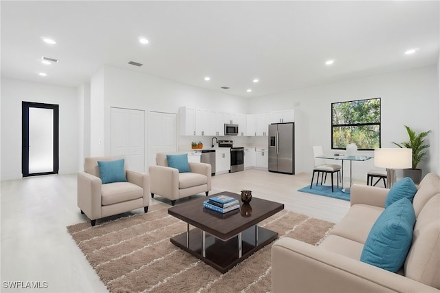5015 Placid Ln, Labelle, FL 33935 - living area featuring light wood-type flooring and recessed lighting