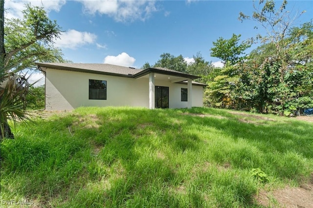 5015 Placid Ln, Labelle, FL 33935 - rear view of property featuring stucco siding
