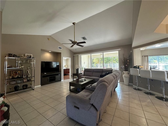4219 Tequesta Dr, Estero, FL 33928 - living room with light tile patterned flooring, lofted ceiling, ceiling fan, and baseboards