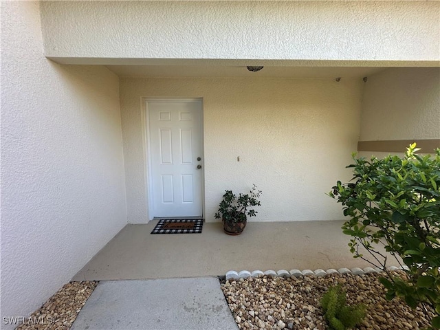 4219 Tequesta Dr, Estero, FL 33928 - property entrance with stucco siding