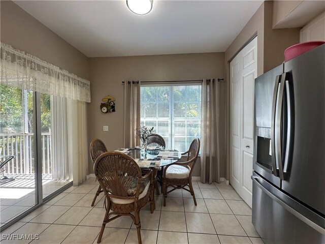 4219 Tequesta Dr, Estero, FL 33928 - dining room with healthy amount of natural light and light tile patterned floors