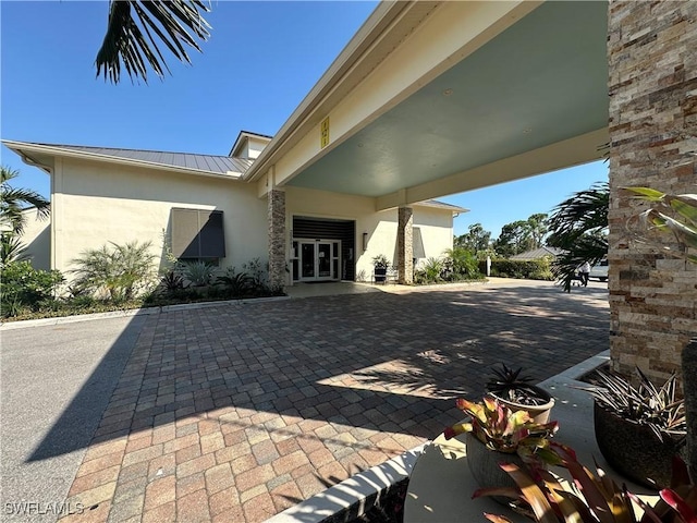 4219 Tequesta Dr, Estero, FL 33928 - view of patio featuring french doors