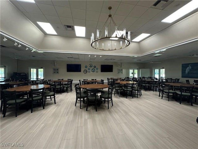 4219 Tequesta Dr, Estero, FL 33928 - dining area with a chandelier and light wood-style floors