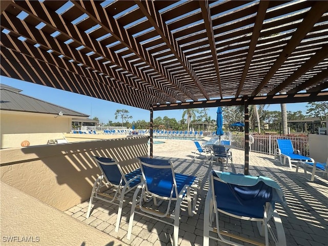 4219 Tequesta Dr, Estero, FL 33928 - view of patio featuring a pergola and a community pool