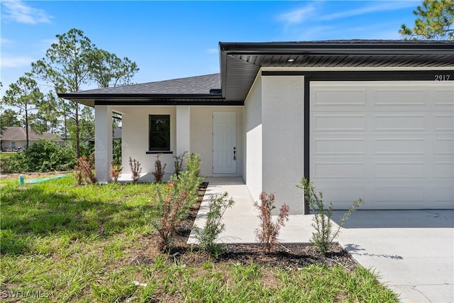 2907 55th St W, Lehigh Acres, FL 33971 - view of front of property featuring stucco siding, a garage, and roof with shingles