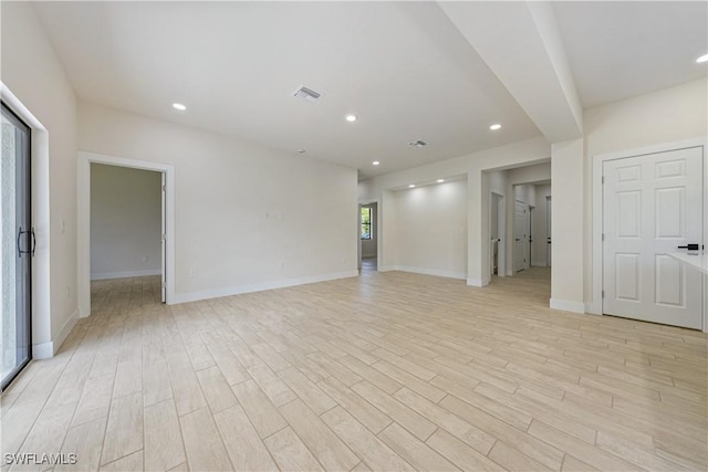2907 55th St W, Lehigh Acres, FL 33971 - spare room with light wood-type flooring and recessed lighting