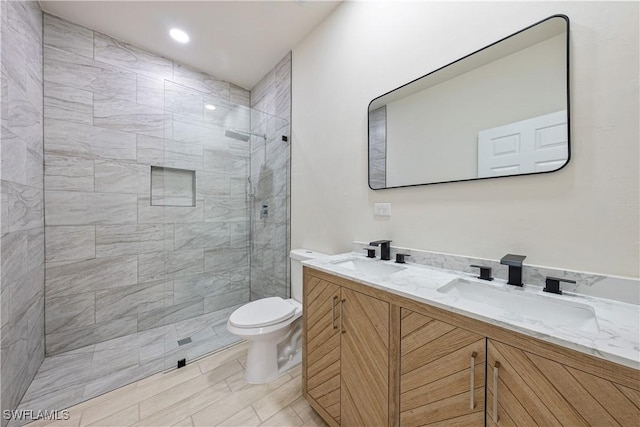 2907 55th St W, Lehigh Acres, FL 33971 - bathroom featuring double vanity, tiled shower, and recessed lighting