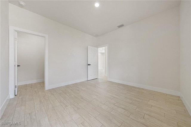 2907 55th St W, Lehigh Acres, FL 33971 - unfurnished room featuring a smoke detector and light wood-type flooring