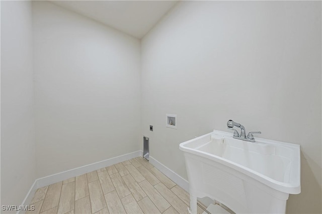 2907 55th St W, Lehigh Acres, FL 33971 - washroom featuring washer hookup, electric dryer hookup, and light wood-style flooring