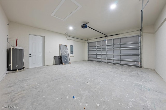 2907 55th St W, Lehigh Acres, FL 33971 - garage with electric panel, a garage door opener, and water heater
