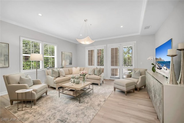 2839 Tiburon Blvd E Unit 102, Naples, FL 34109 - living room with light wood-style floors, crown molding, and recessed lighting