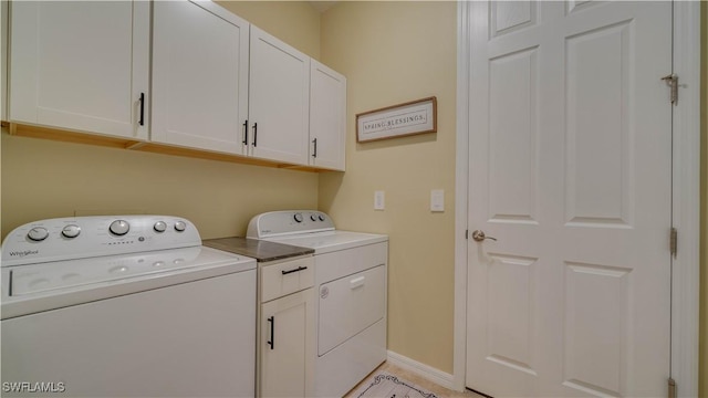 2541 SW 32nd Ln, Cape Coral, FL 33914 - laundry area featuring washing machine and clothes dryer, cabinet space, and baseboards