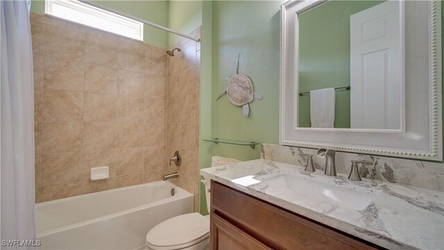 2541 SW 32nd Ln, Cape Coral, FL 33914 - bathroom with toilet, vanity, and shower / bath combo with shower curtain
