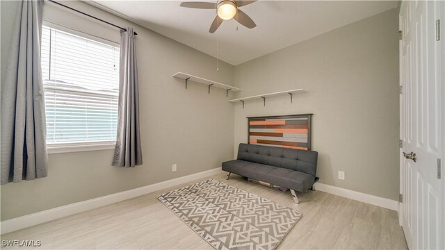 2541 SW 32nd Ln, Cape Coral, FL 33914 - sitting room featuring ceiling fan, plenty of natural light, baseboards, and wood finished floors