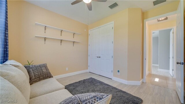 2541 SW 32nd Ln, Cape Coral, FL 33914 - living room featuring ceiling fan, wood finished floors, and baseboards
