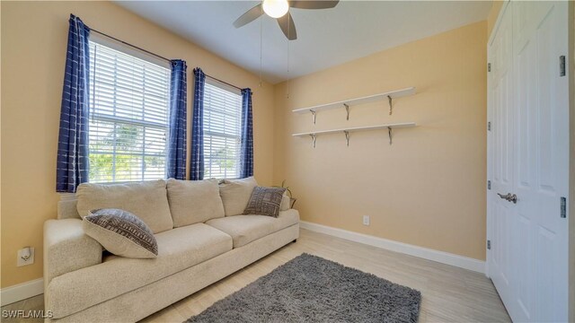 2541 SW 32nd Ln, Cape Coral, FL 33914 - living room with ceiling fan, baseboards, and light wood-style floors
