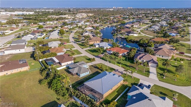 2541 SW 32nd Ln, Cape Coral, FL 33914 - aerial perspective of suburban area with a nearby body of water