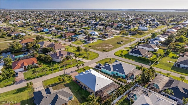 2541 SW 32nd Ln, Cape Coral, FL 33914 - aerial perspective of suburban area with a large body of water