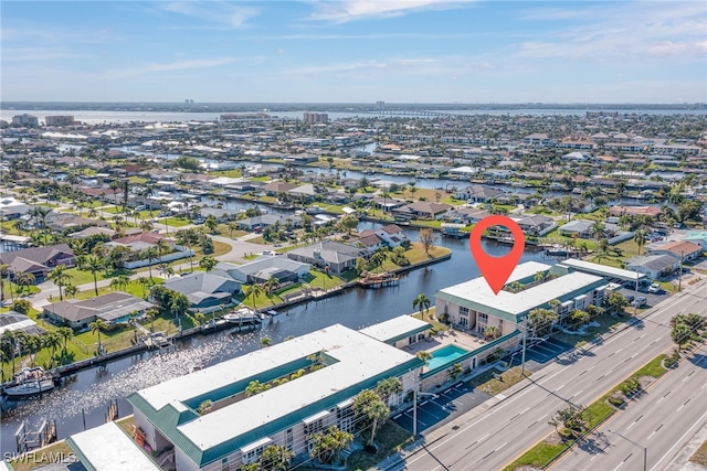 3905 Del Prado Blvd S Unit D-101, Cape Coral, FL 33904 - aerial perspective of suburban area featuring a large body of water