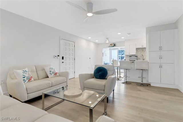 3905 Del Prado Blvd S Unit D-101, Cape Coral, FL 33904 - living area with light wood-type flooring, a ceiling fan, and recessed lighting