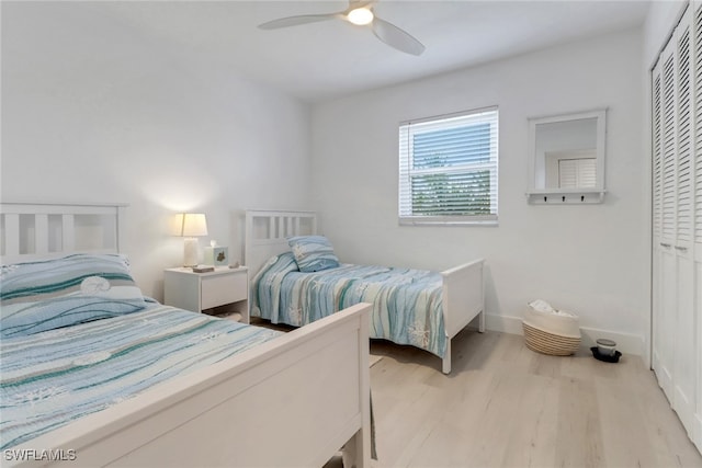3905 Del Prado Blvd S Unit D-101, Cape Coral, FL 33904 - bedroom with a closet, wood finished floors, a ceiling fan, and baseboards