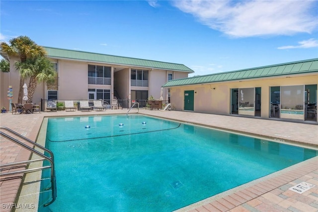 3905 Del Prado Blvd S Unit D-101, Cape Coral, FL 33904 - community pool with a patio area