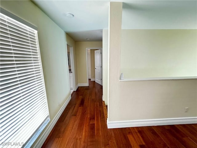 25560 Springtide Ct, Bonita Springs, FL 34135 - hall featuring wood finished floors and baseboards