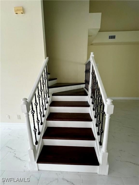 25560 Springtide Ct, Bonita Springs, FL 34135 - stairs featuring marble look tiles and baseboards