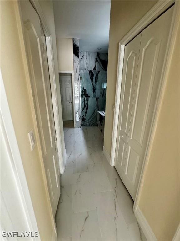 25560 Springtide Ct, Bonita Springs, FL 34135 - hallway with light marble finish floors and baseboards