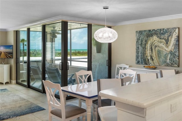 6672 Estero Blvd Unit A207, Fort Myers Beach, FL 33931 - dining area with crown molding, light tile patterned flooring, and expansive windows