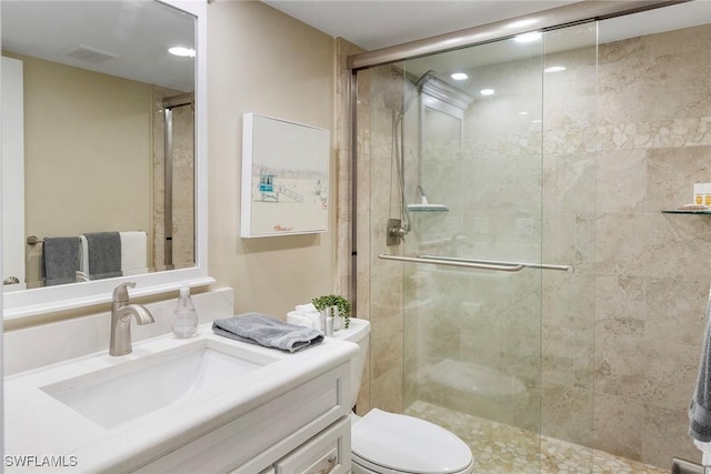 6672 Estero Blvd Unit A207, Fort Myers Beach, FL 33931 - bathroom with vanity, toilet, a shower stall, and recessed lighting