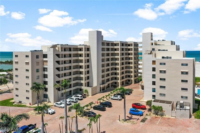 6672 Estero Blvd Unit A207, Fort Myers Beach, FL 33931 - view of apartment building / complex with a water view and uncovered parking