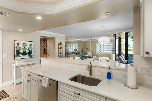 6672 Estero Blvd Unit A207, Fort Myers Beach, FL 33931 - kitchen with stainless steel dishwasher, a sink, ornamental molding, light countertops, and open floor plan