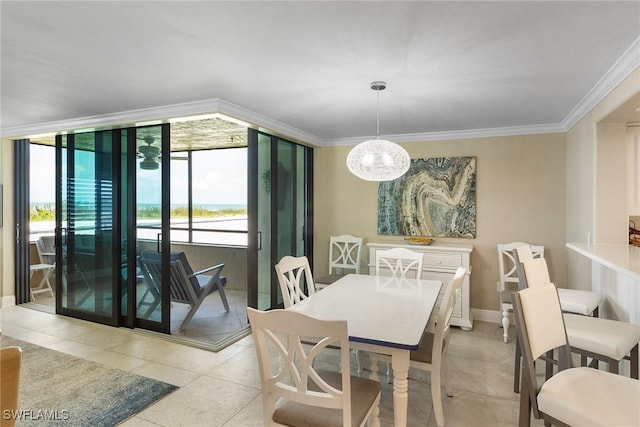 6672 Estero Blvd Unit A207, Fort Myers Beach, FL 33931 - dining space featuring light tile patterned floors, a chandelier, and ornamental molding