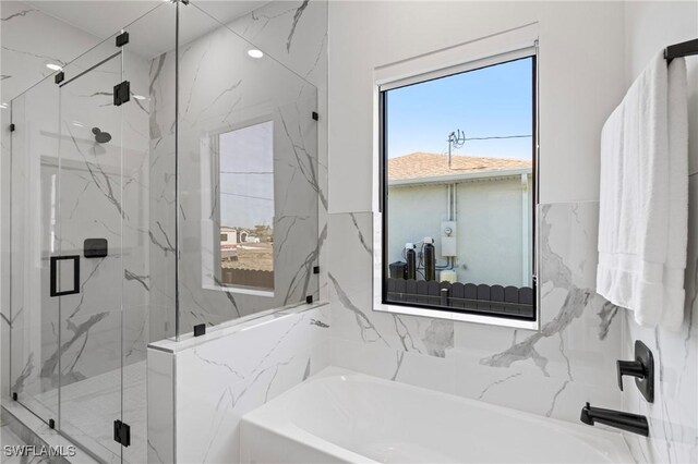 1917 NW 24th Ave, Cape Coral, FL 33993 - bathroom with a bath and a marble finish shower