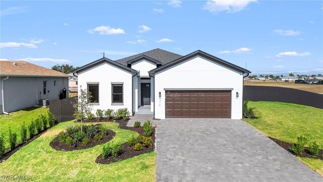 1917 NW 24th Ave, Cape Coral, FL 33993 - single story home featuring a garage, decorative driveway, and stucco siding