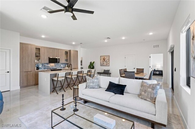 2308 NW 5th St, Cape Coral, FL 33993 - living area with a ceiling fan and recessed lighting