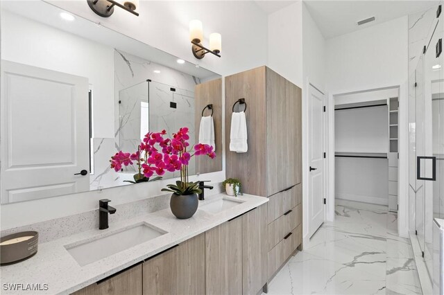 2308 NW 5th St, Cape Coral, FL 33993 - full bathroom featuring marble finish flooring, a marble finish shower, double vanity, recessed lighting, and a walk in closet