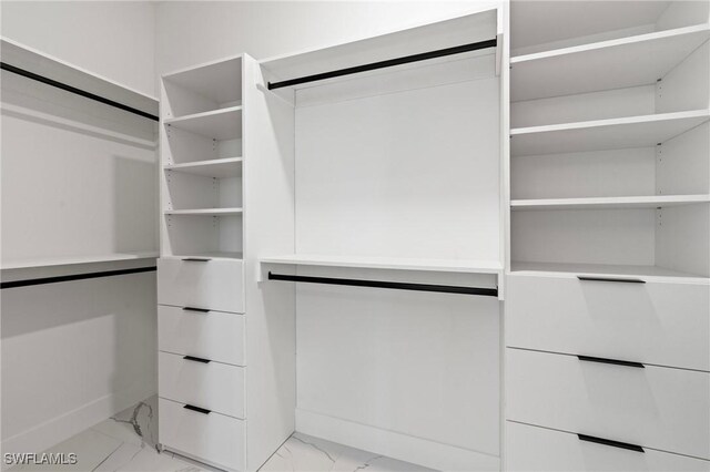 2308 NW 5th St, Cape Coral, FL 33993 - walk in closet featuring light marble finish flooring