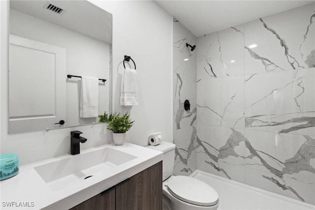 2308 NW 5th St, Cape Coral, FL 33993 - bathroom with a marble finish shower, toilet, and vanity