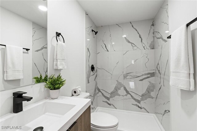2308 NW 5th St, Cape Coral, FL 33993 - full bathroom featuring toilet, a marble finish shower, and vanity
