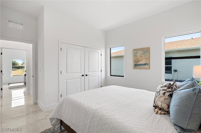 2308 NW 5th St, Cape Coral, FL 33993 - bedroom with multiple windows and a closet