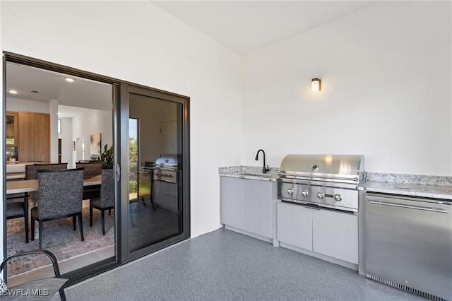 2308 NW 5th St, Cape Coral, FL 33993 - view of patio with an outdoor kitchen, a grill, and a sink