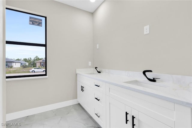 290731 St St W, Lehigh Acres, FL 33971 - full bathroom with baseboards, marble finish flooring, and double vanity