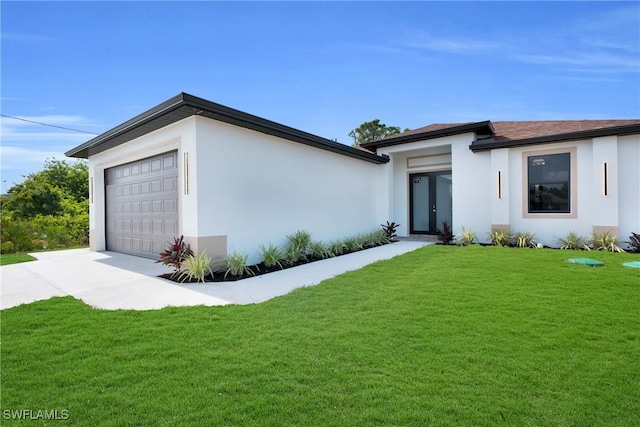 290731 St St W, Lehigh Acres, FL 33971 - view of front of home featuring an attached garage, stucco siding, and a front lawn
