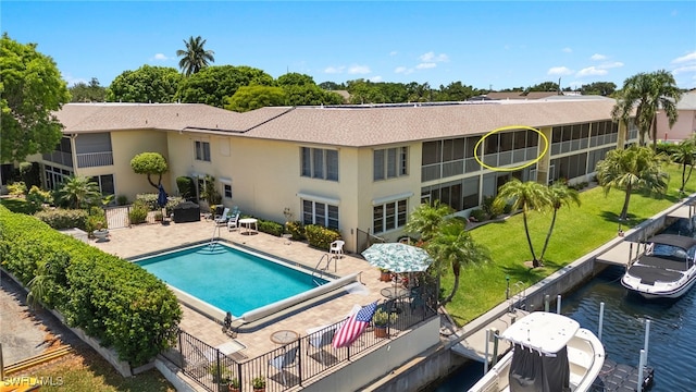 1345 SE 40th Ter Unit 2D, Cape Coral, FL 33904 - rear view of house with a patio, a water view, and stucco siding