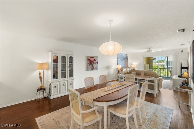 1345 SE 40th Ter Unit 2D, Cape Coral, FL 33904 - dining space featuring dark wood-style floors, a ceiling fan, and baseboards