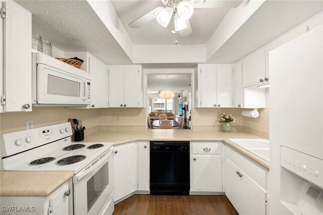 1345 SE 40th Ter Unit 2D, Cape Coral, FL 33904 - kitchen featuring white appliances, a ceiling fan, white cabinets, backsplash, and light countertops