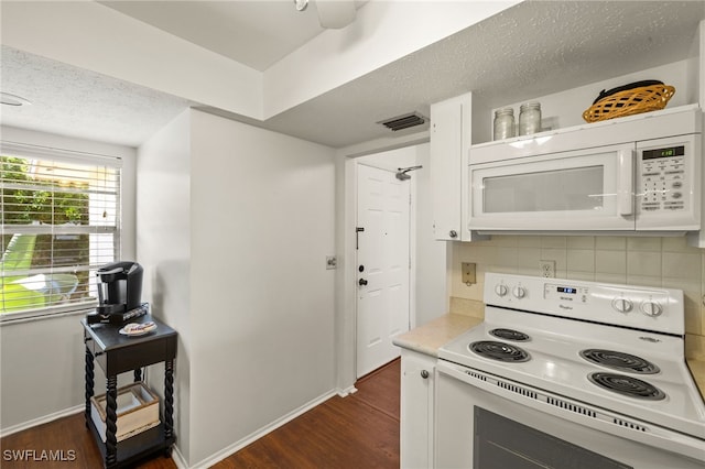 1345 SE 40th Ter Unit 2D, Cape Coral, FL 33904 - kitchen featuring white appliances, dark wood-style flooring, decorative backsplash, white cabinets, and a textured ceiling